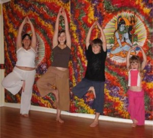 Me with my children practicing Tree posture, vrksasana